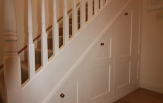 Painted shaker under stairs storage solution