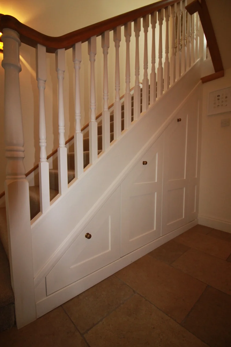 Painted shaker under stairs storage solution